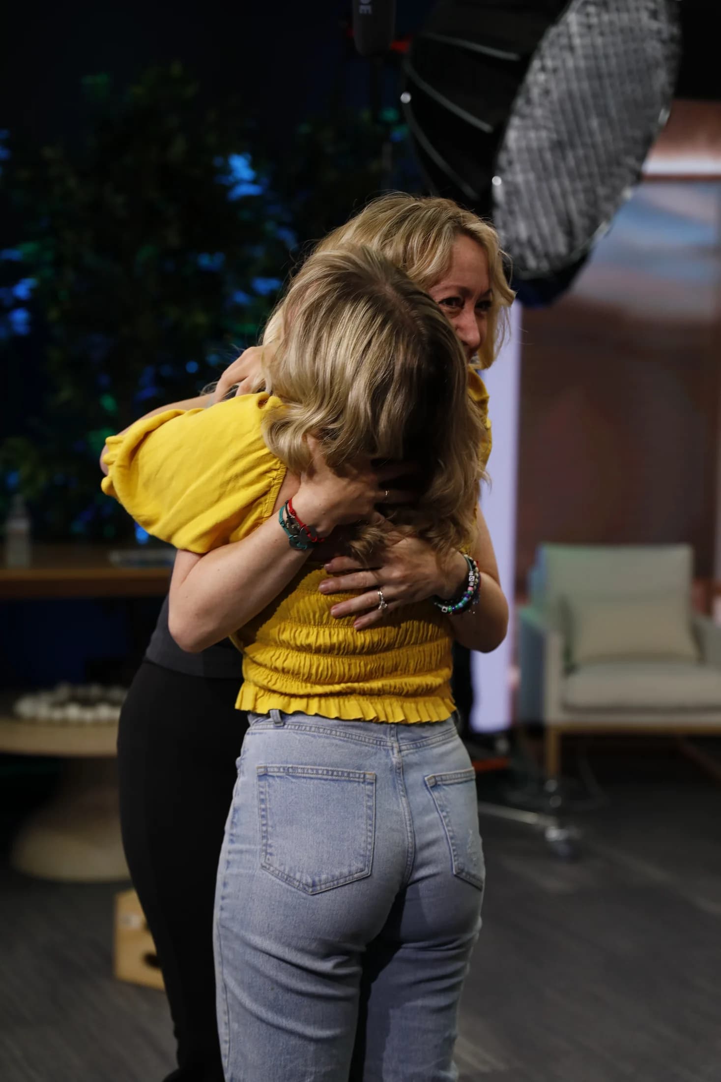 Andrea offering a joyful, supportive hug